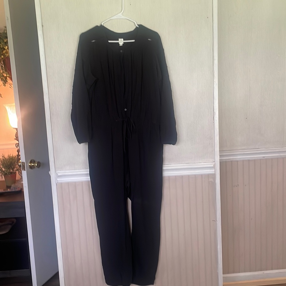 Beautiful one piece jump suit. Button up with draw string.